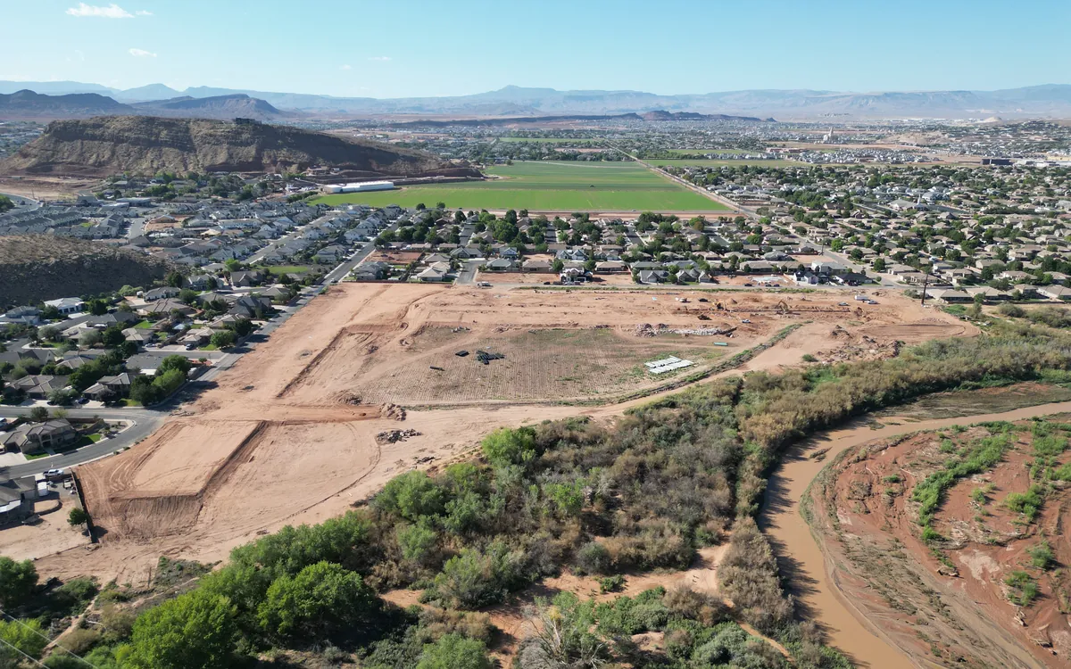 Aerial photo of the Stillwater site with the river corridor and red rock beyond
